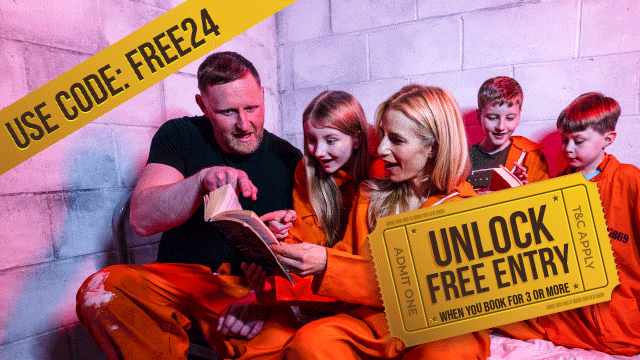 Family enjoying prison themed escape room puzzle in orange jumpsuits with free entry logo in corner