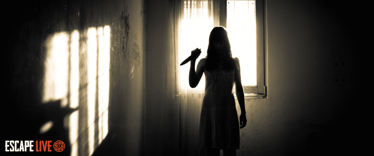 girl holding knife with sepia lighting like a horror film